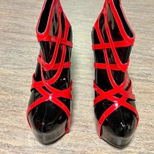 Show story high heels glossy black and red shoes